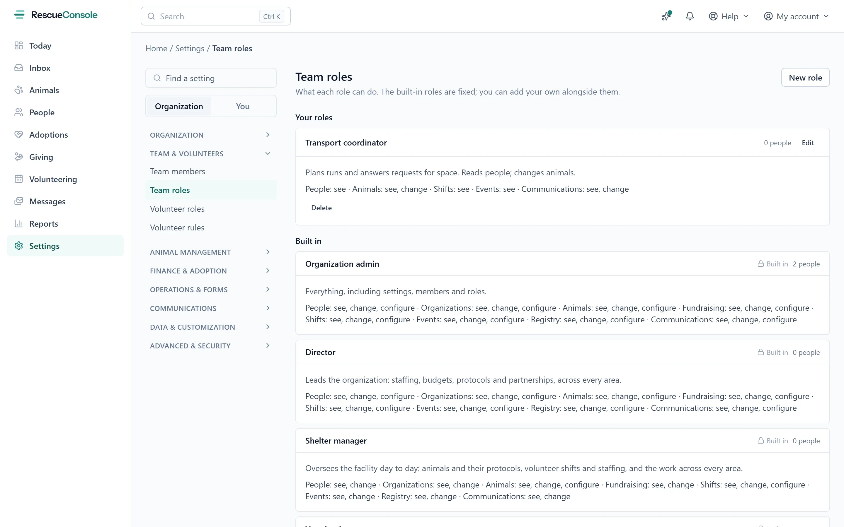 Team roles in Settings: a role of the rescue’s own, then the built-in roles, each saying what it may see, change and configure, area by area. Open it larger.